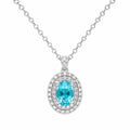 Diamond necklace with a blue gemstone on a white background