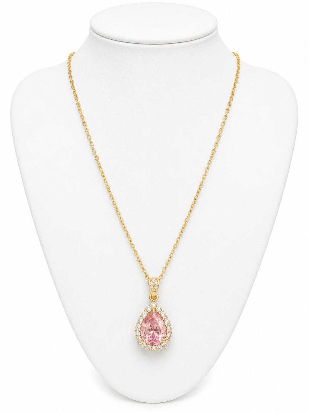Gold necklace with a pink teardrop pendant on a white mannequin bust.