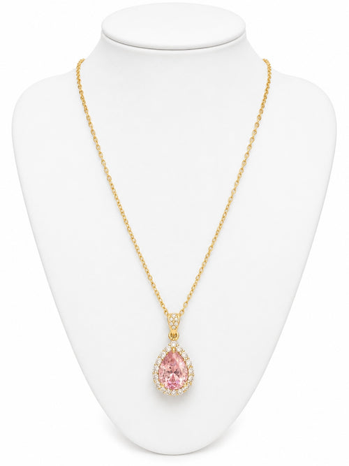 Gold necklace with a pink teardrop pendant on a white mannequin bust.