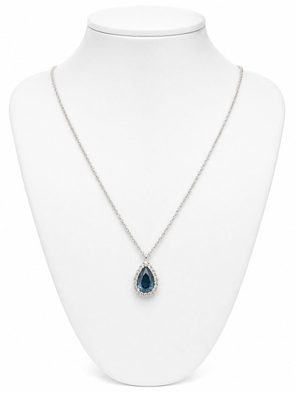 Necklace with a blue teardrop pendant on a white mannequin bust.