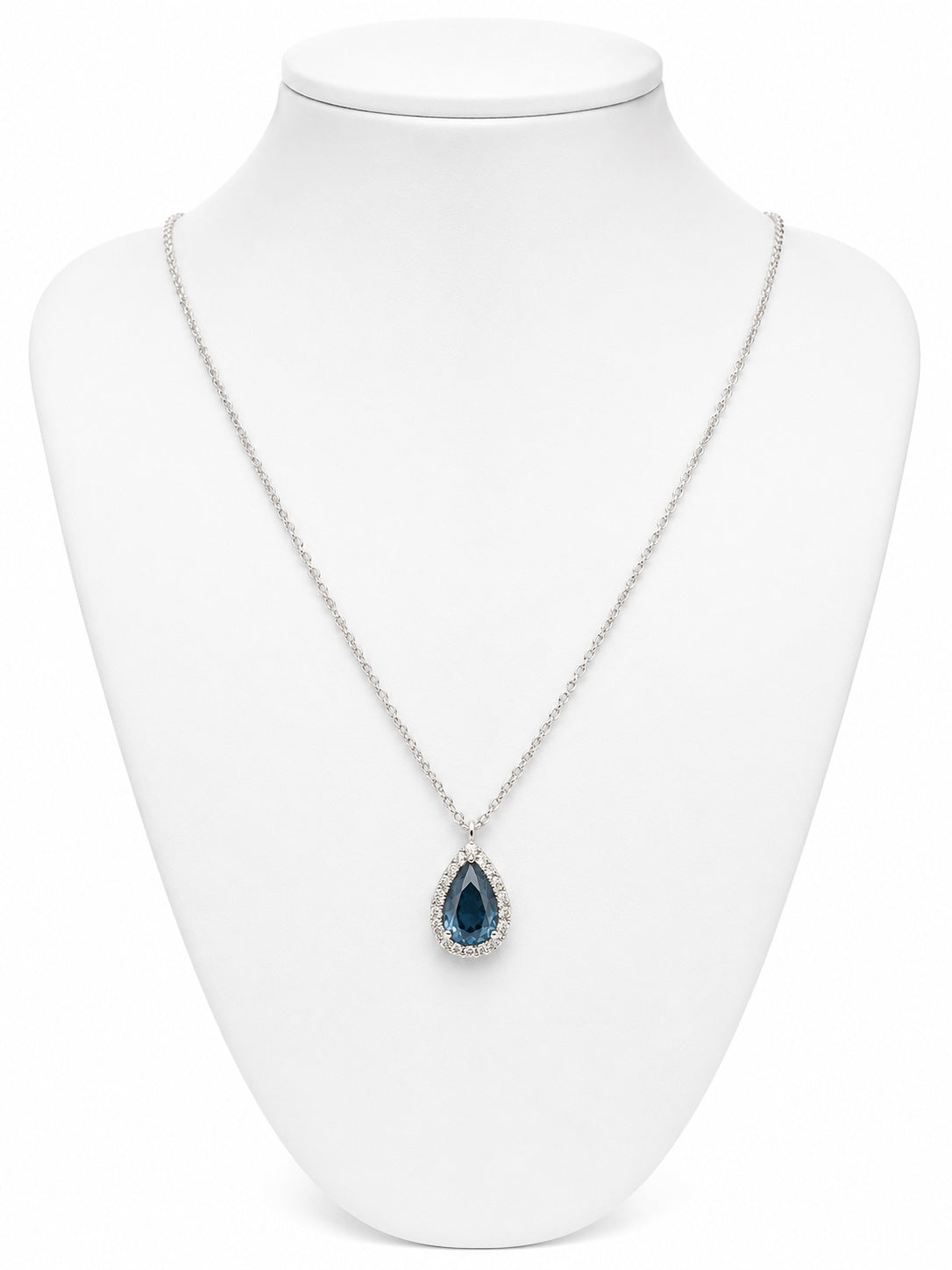 Necklace with a blue teardrop pendant on a white mannequin bust.
