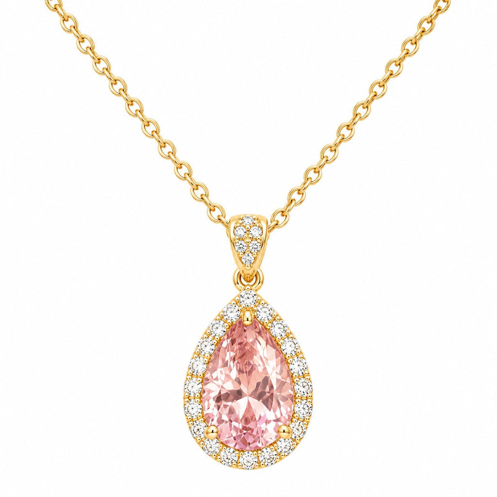 Gold necklace with a pink teardrop-shaped gemstone pendant on a white background