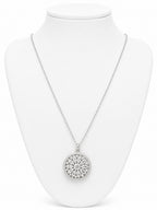 Silver necklace with a circular pendant on a white mannequin bust.