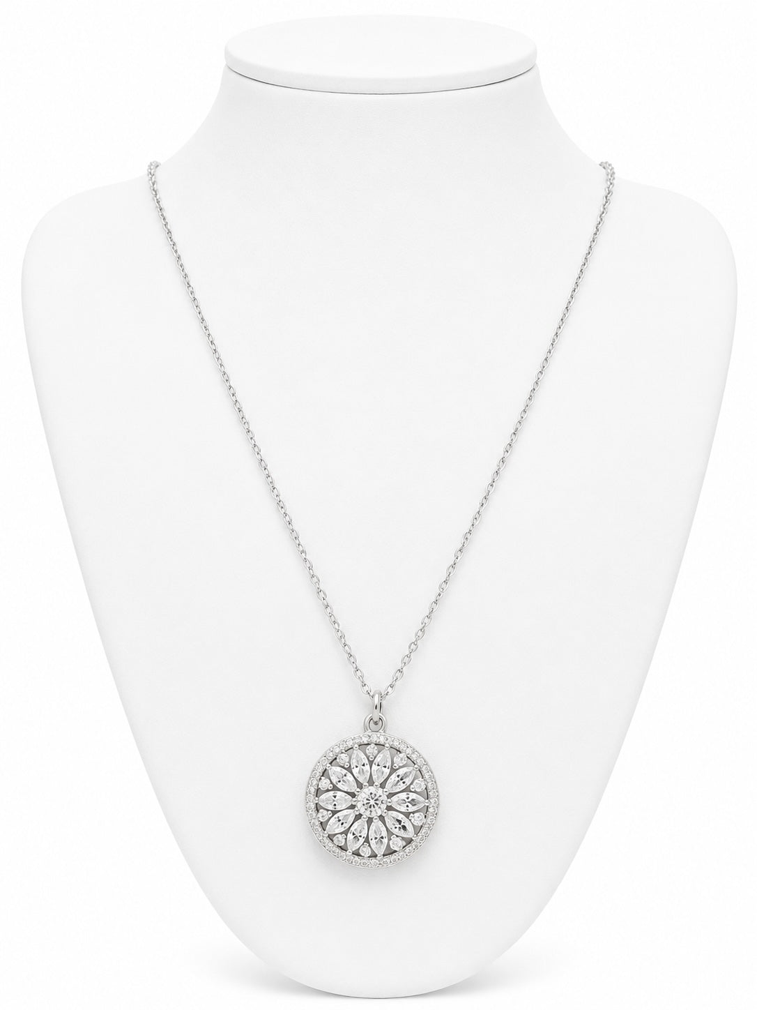 Silver necklace with a circular pendant on a white mannequin bust.