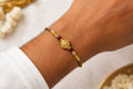 Premium Designer Rakhi with Gold Floral Centerpiece