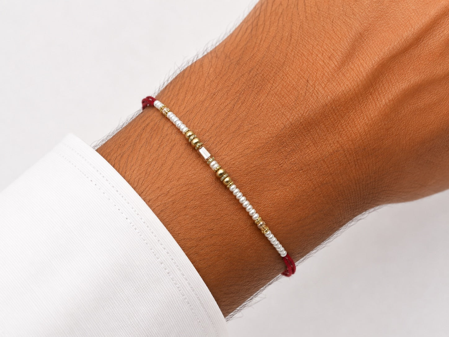 Elegant Pearl & Gold Rakhi – Handmade Minimalist Raksha Bandhan Bracelet