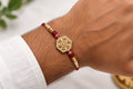 Royal Hexagon Crystal Rakhi – Premium Gold Designer Rakhi for Brother