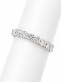 Silver ring with diamonds on a white background