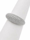 Silver ring with embedded stones on a white napkin