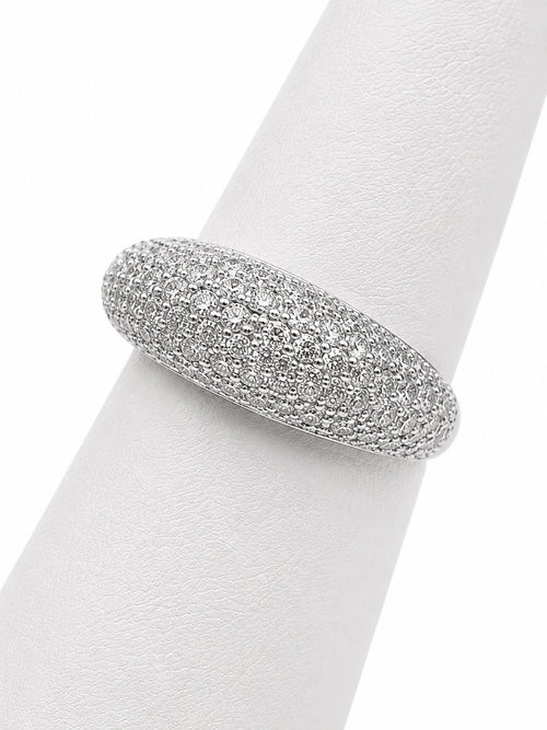 Silver ring with embedded stones on a white napkin