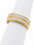 Gold and diamond ring on a white background