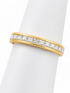 Gold ring with diamonds on a white background