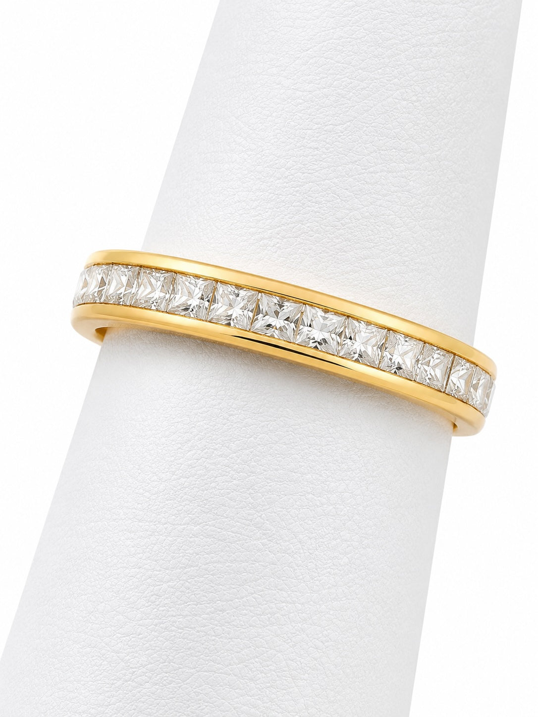 Gold ring with diamonds on a white background