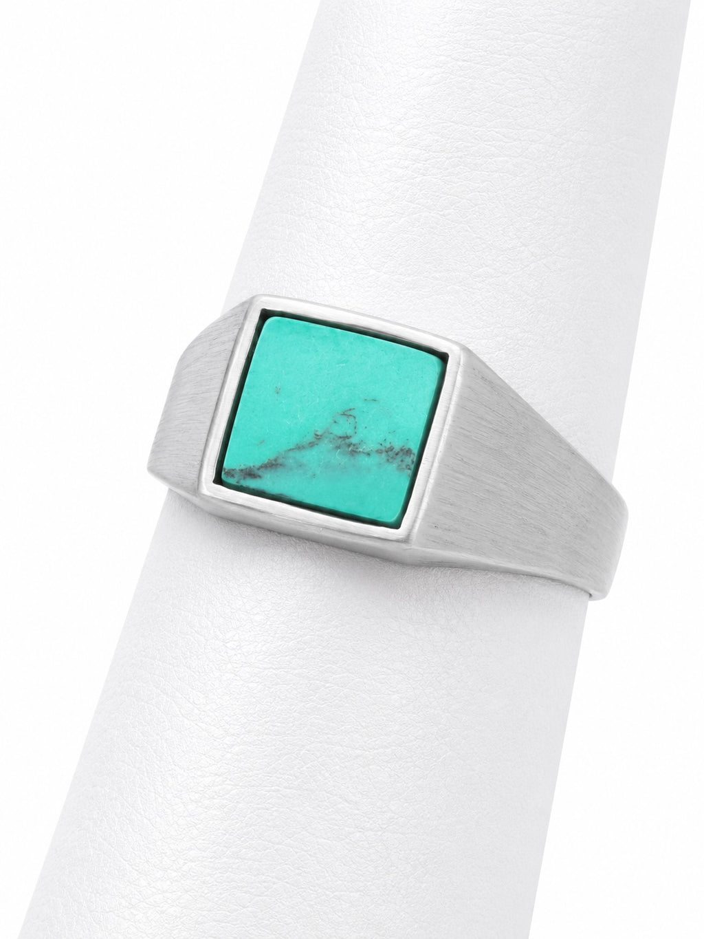 Turquoise stone ring on a white background