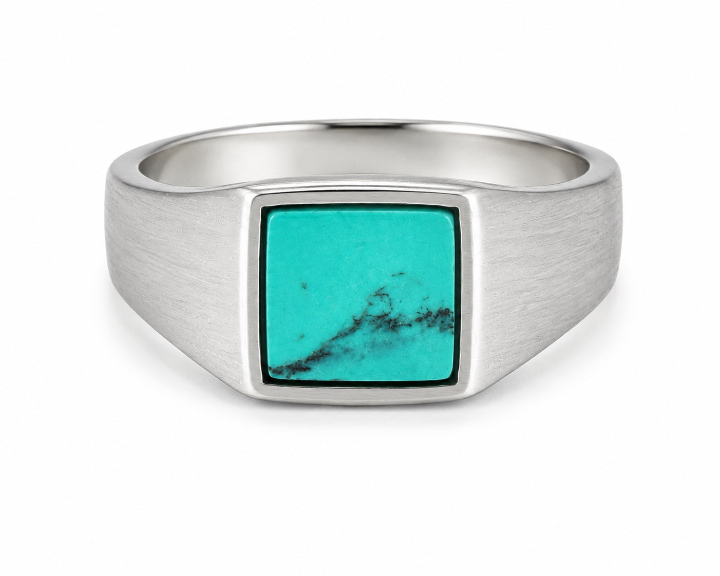 Silver ring with a turquoise stone on a white background