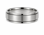Silver ring with a brushed finish on a white background