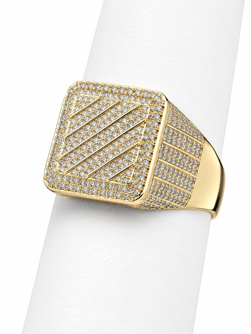 Gold ring with diamond accents on a white background