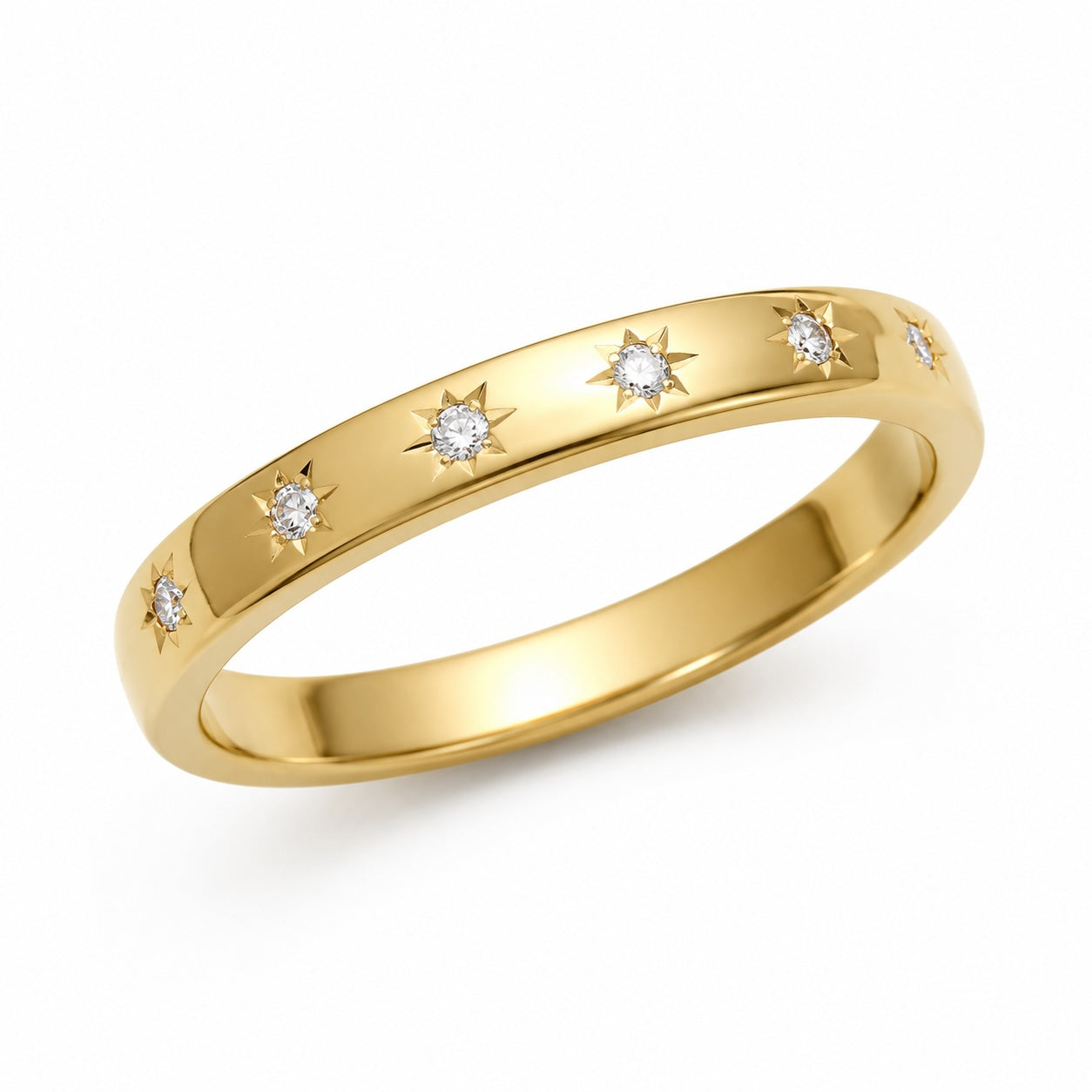 Gold ring with diamond accents on a white background