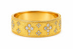 Gold ring with diamond accents on a white background