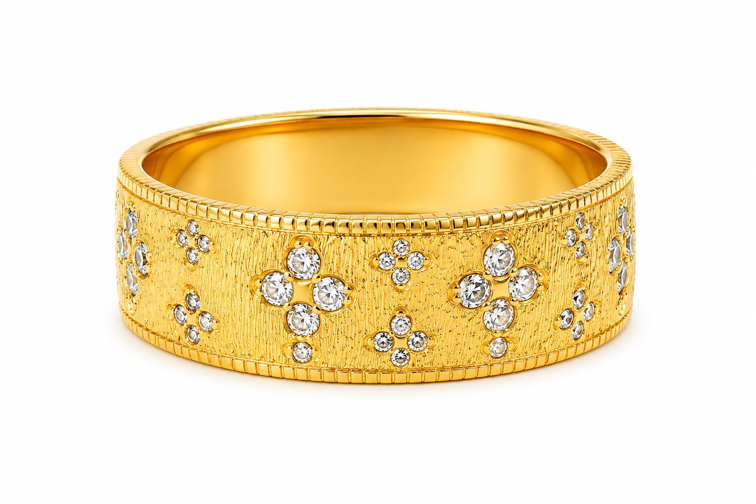 Gold ring with diamond accents on a white background