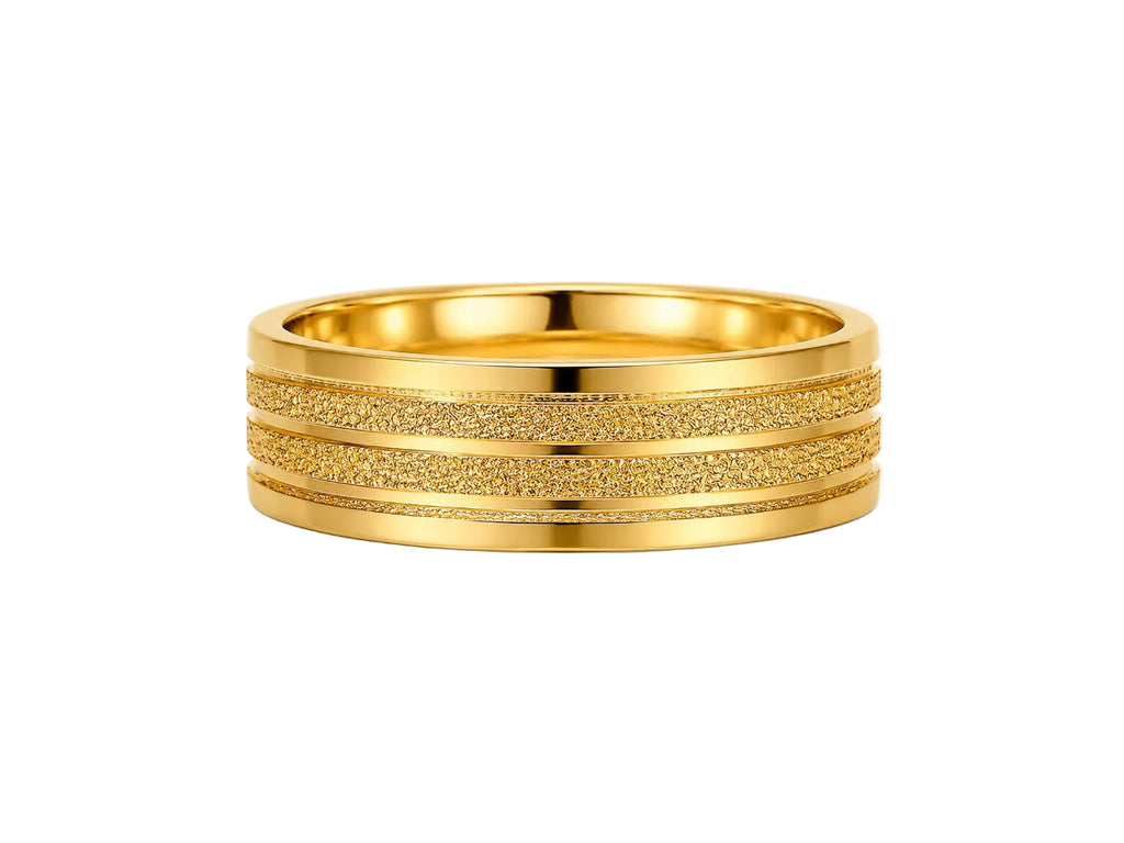 Gold ring with textured band on a white background