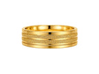 Gold ring with textured band on a white background