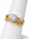 Gold ring with a large diamond on a white background