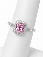 Pink gemstone ring with silver setting on a mannequin hand
