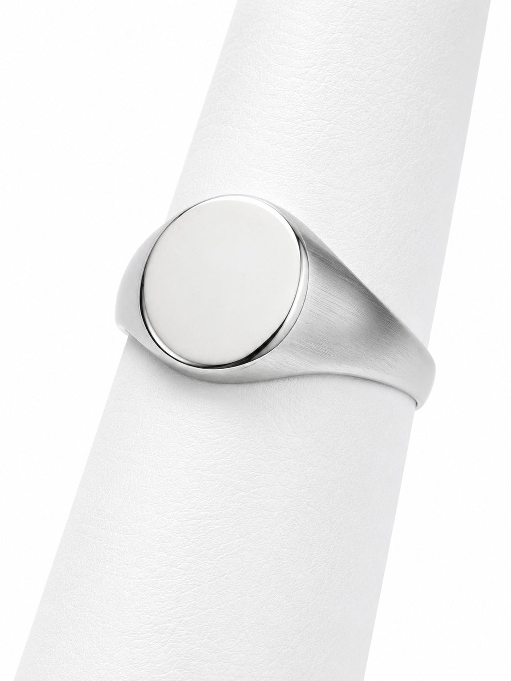 Close-up of a silver ring on a white background