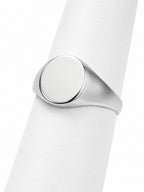 Close-up of a silver ring on a white background