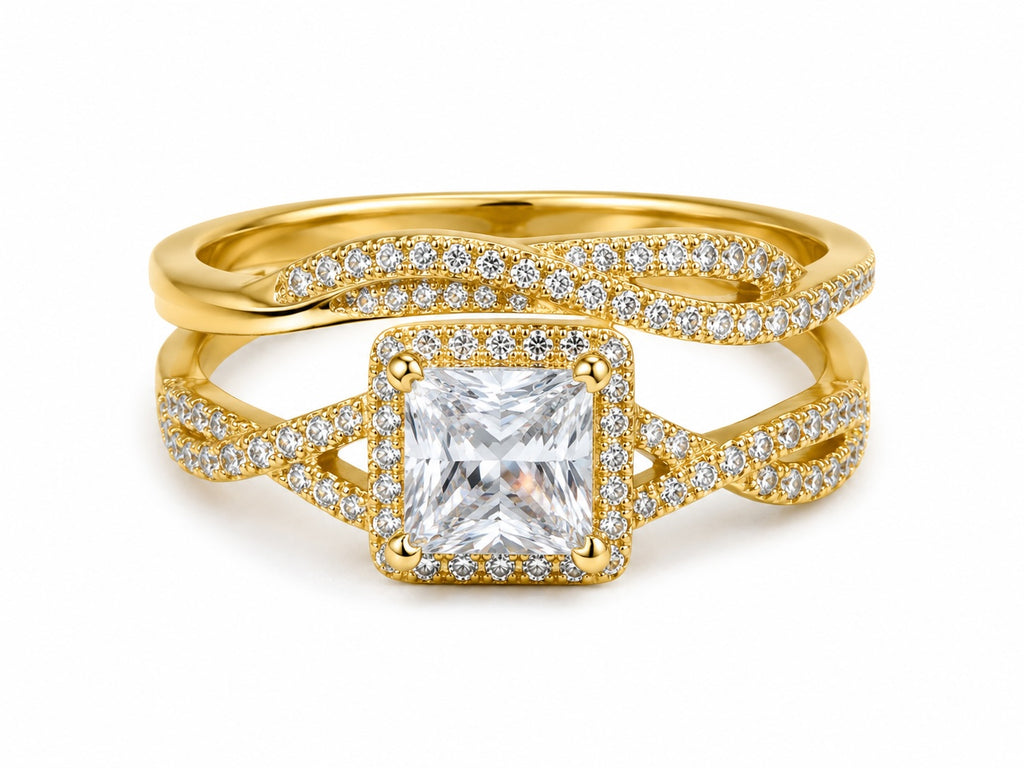 Gold ring with a large diamond and smaller diamonds on a white background