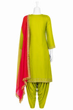 Green traditional outfit with red dupatta on a white background