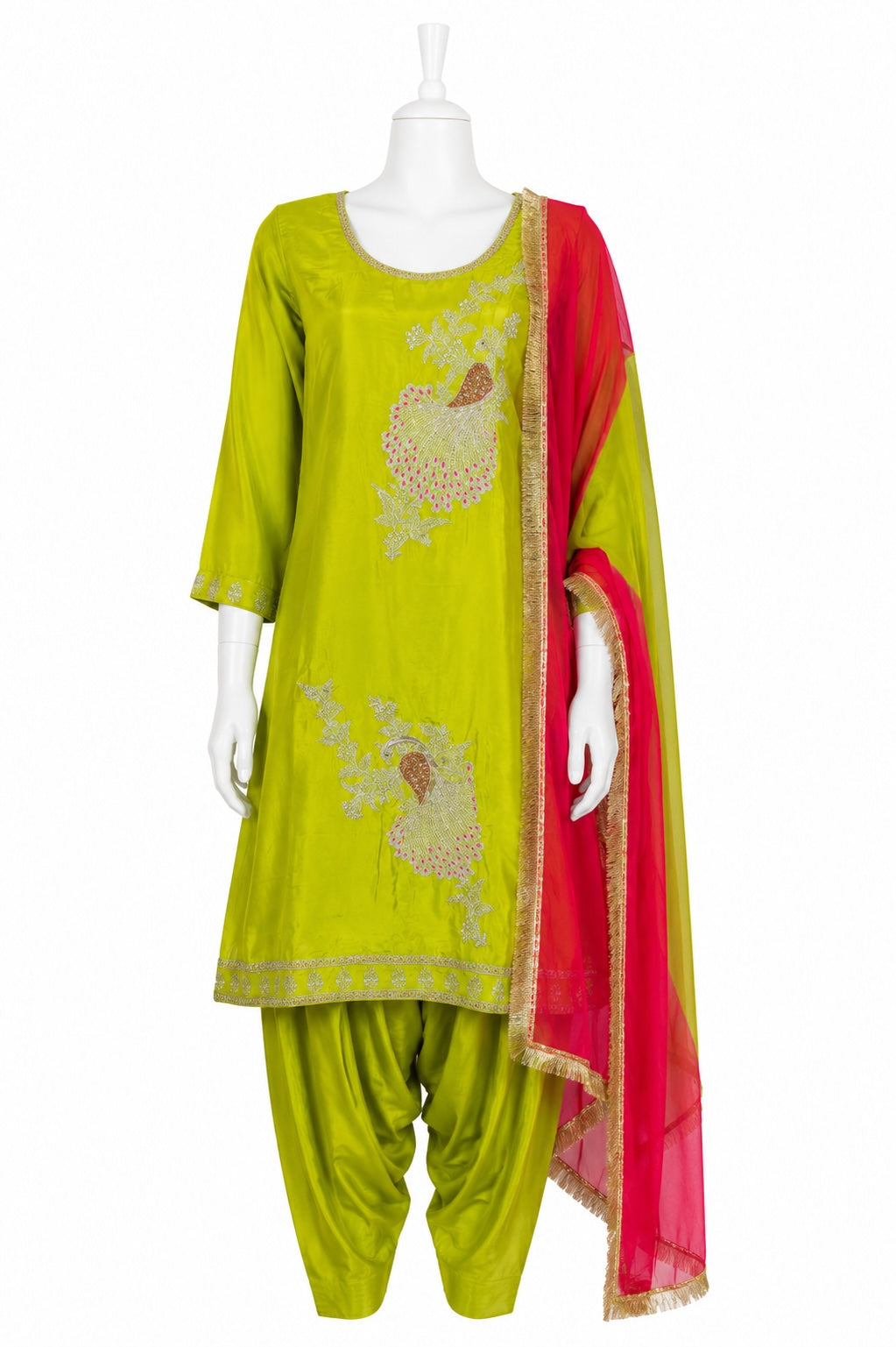 Green embroidered outfit with red dupatta on a mannequin against a white background