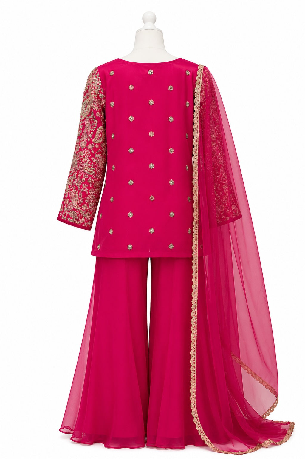 Pink traditional outfit with embroidered details on a white background