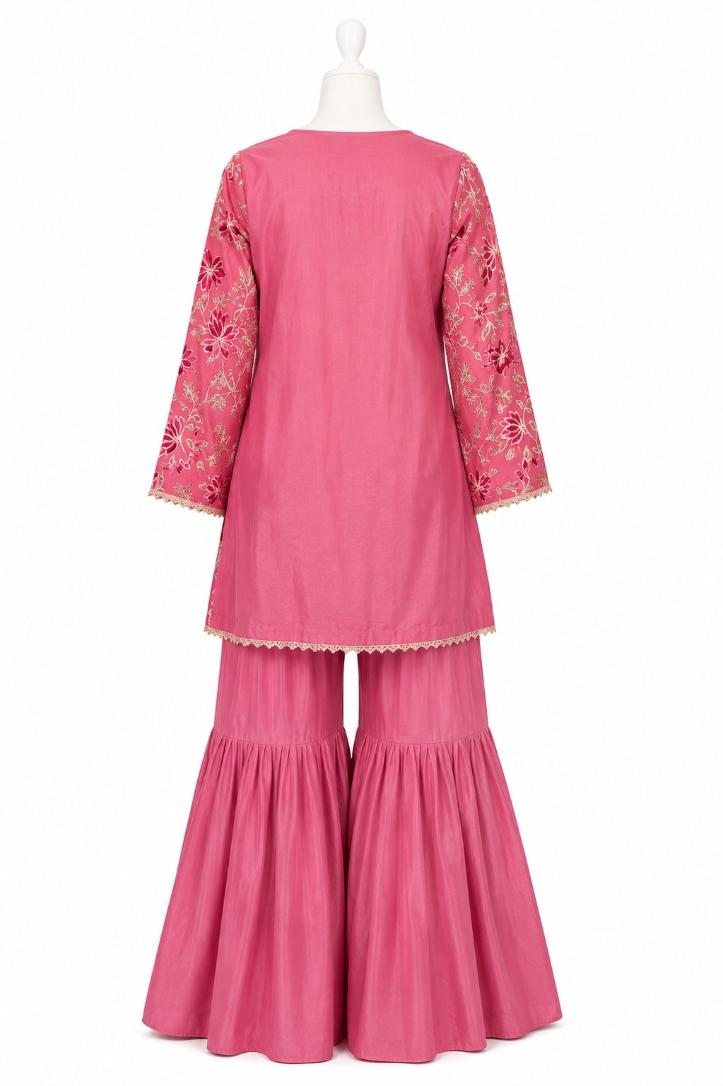 Pink embroidered outfit on a mannequin against a white background