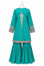 Teal traditional outfit with intricate patterns on a white background