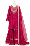Pink traditional outfit with intricate embroidery on a white background