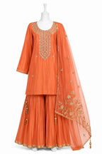 Orange traditional outfit with embroidered details on a white background