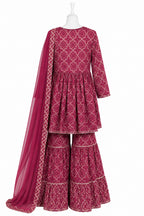 Maroon patterned traditional outfit with a dupatta on a white background