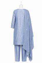 Light blue outfit with a long top and pants on a white background