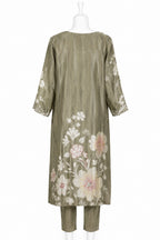 Green floral embroidered dress on a white mannequin against a white background