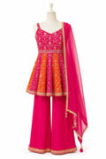 Traditional outfit with pink and orange dress on a mannequin against a white background